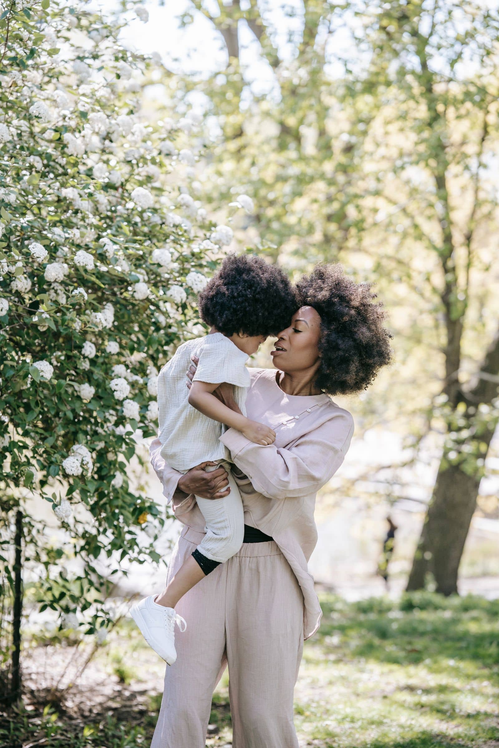Mother holding her child in the park